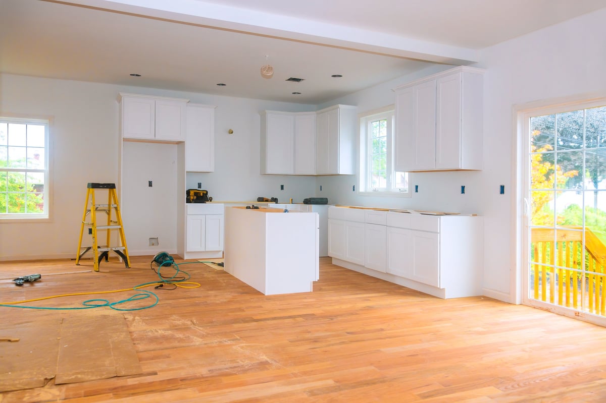 Bright interior with new cabinetry and flooring during construction